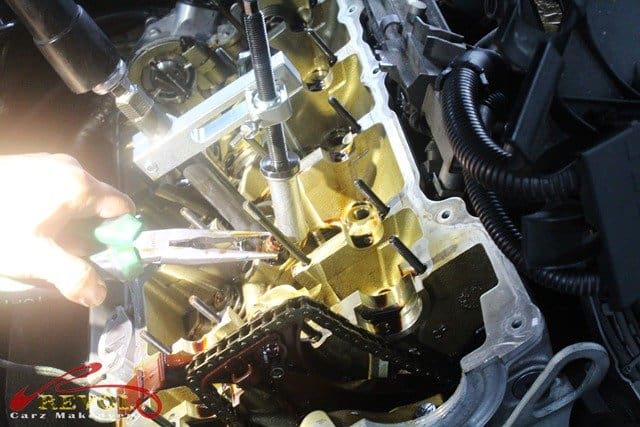 The careful, surgery-like extraction of the worn valve seals.