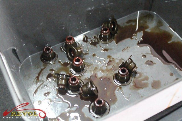 The new valve stem seals being installed on the valves.