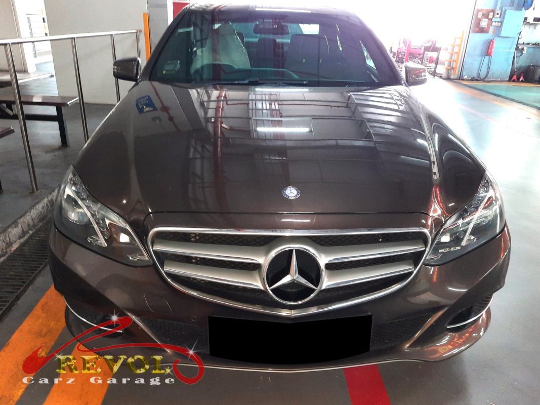 Mercedes-Benz E200 parked at the workshop for regular servicing.