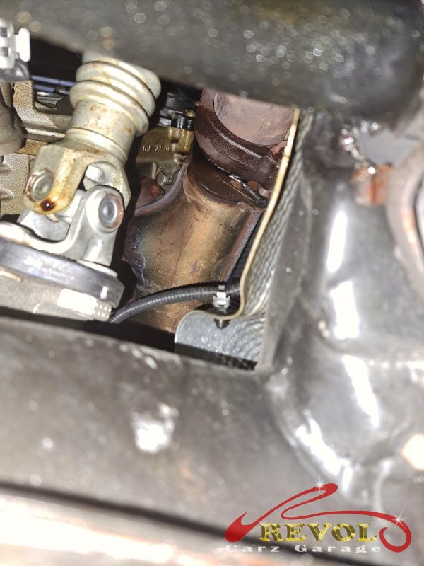 The oil weep at the camshaft seal flagged during the service inspection.