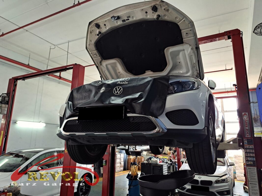 The worn engine mount with cracked and sunken rubber on the Mercedes-Benz GLC250.
