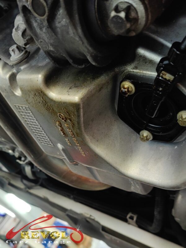 The old oil level sensor removed from the base of the sump.
