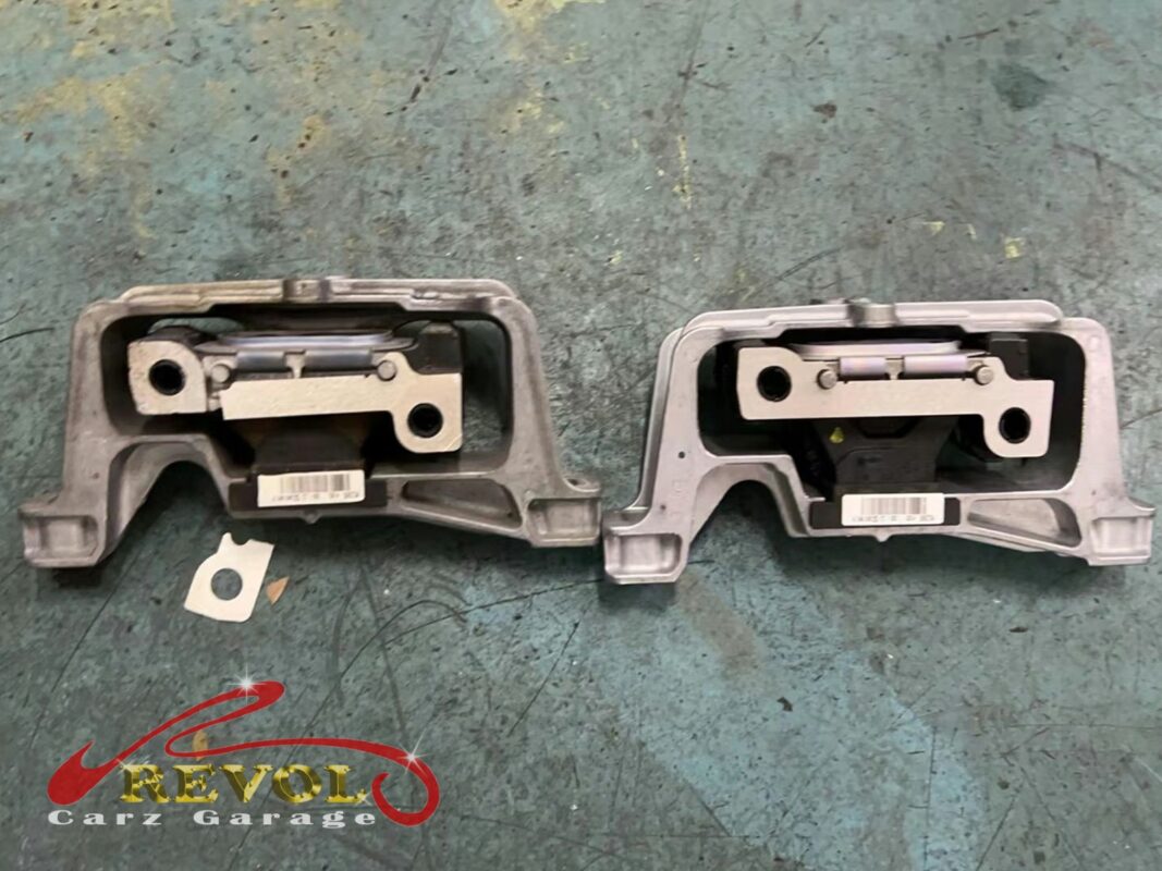 The gearbox mount removed showing the play under load.