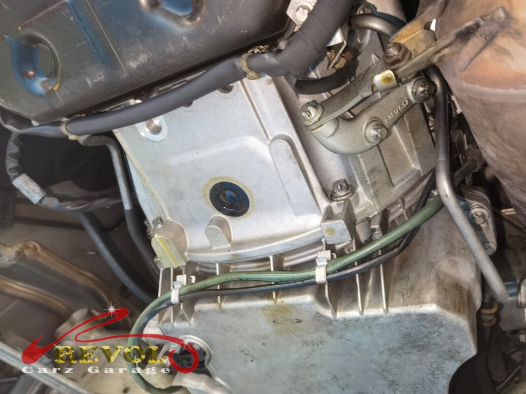 The transmission pan dropped and the old gasket and filter exposed.