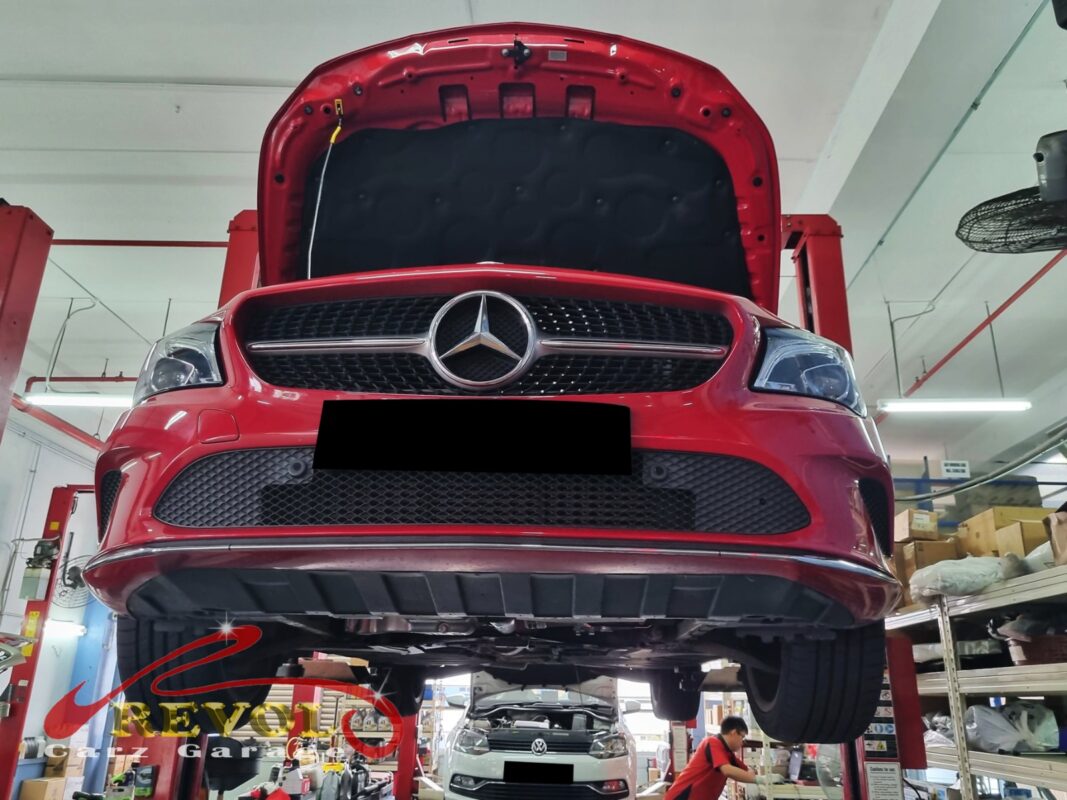 The worn front brake pads on the Mercedes-Benz CLA200, down to the indicator.