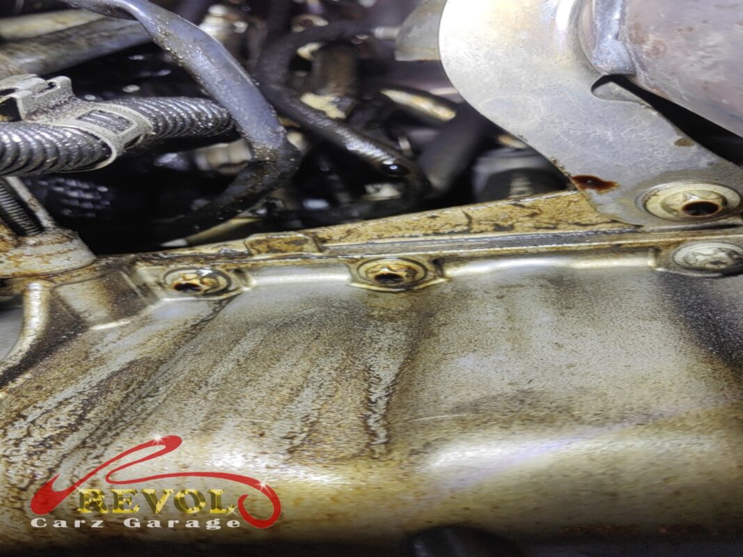 The valve cover removed and the old hardened gasket exposed.