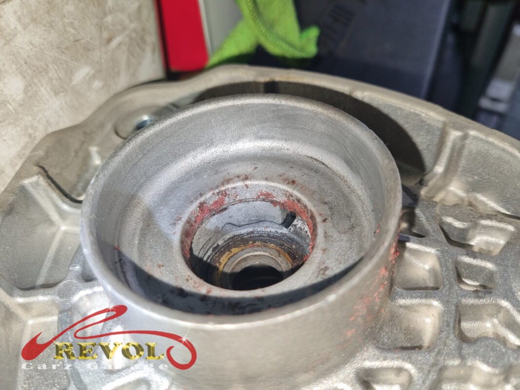 The old mountings removed beside the new Mercedes-spec replacements.