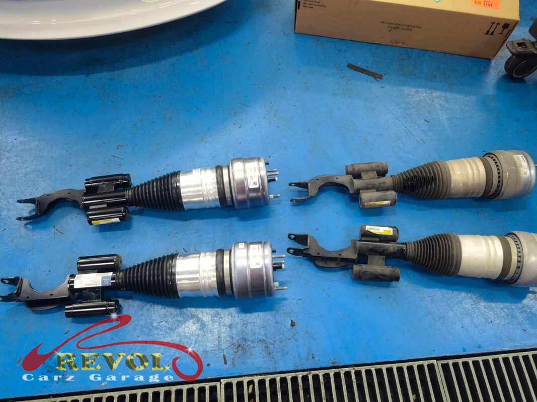 The old front air strut removed from the car.