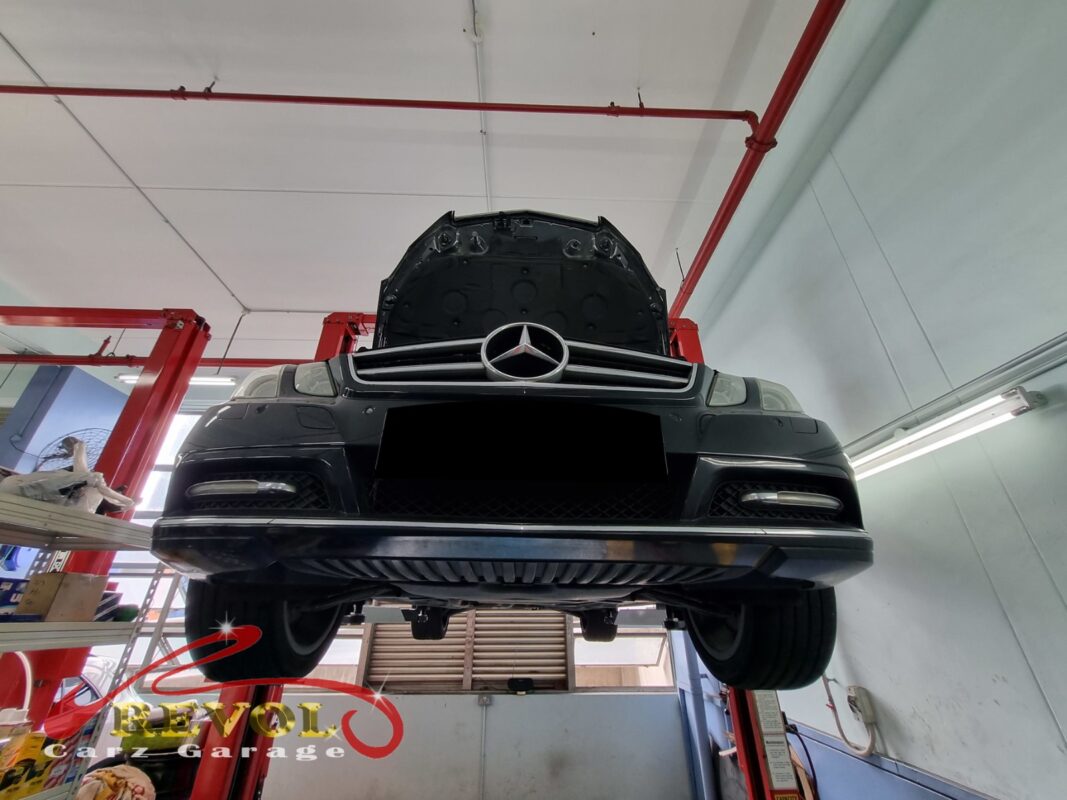 The transmission pan dropped on the Mercedes-Benz E250 for the ATF service.