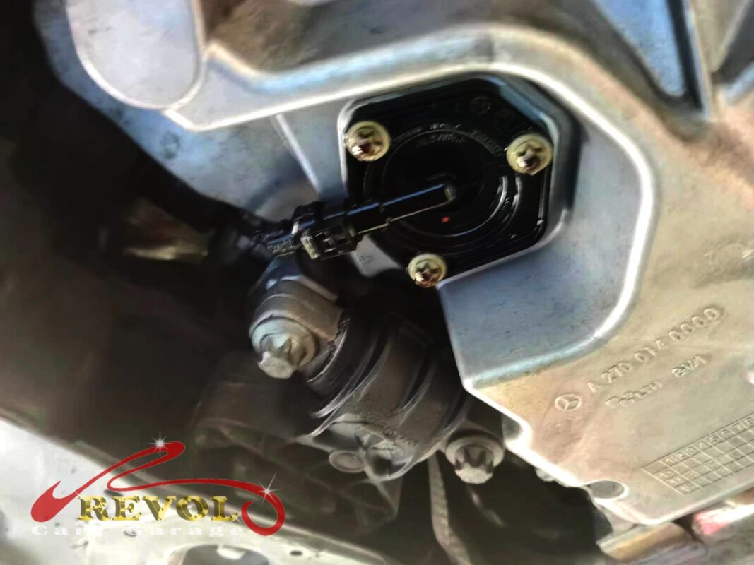 The old oil level sensor removed from the base of the sump.