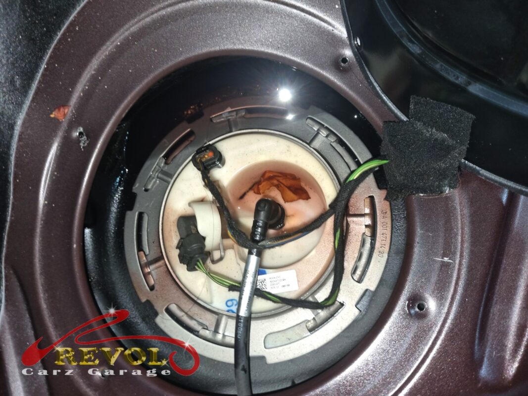 The fuel pump module accessed through the hatch on the Mercedes-Benz E200.