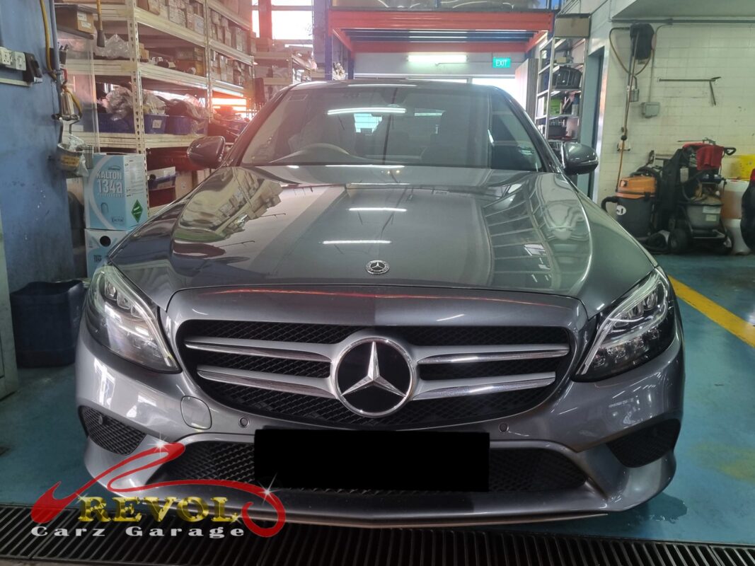 Mercedes-Benz C180 with the engine bay open for alternator replacement.