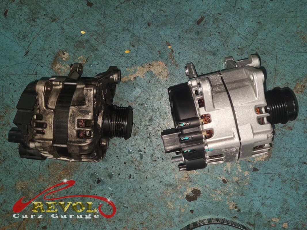 The old alternator (left, grimy) beside the new Mercedes-spec replacement (right).
