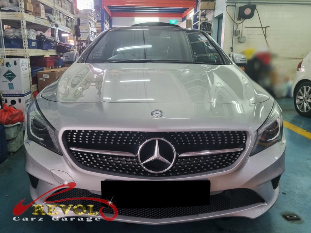 Mercedes-Benz CLA 180 with the front bumper off for radiator replacement.