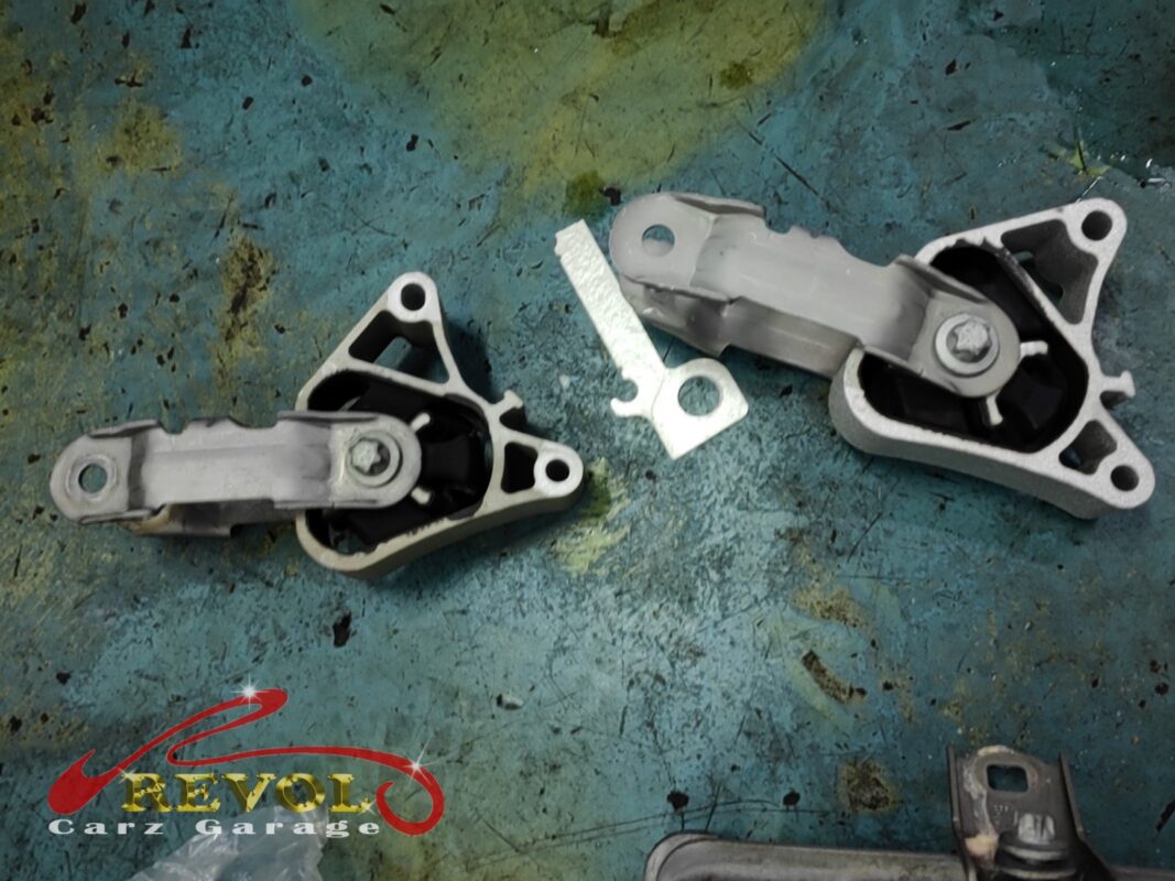Two of the old mounts off the car, the rubber collapsed in their cradles.