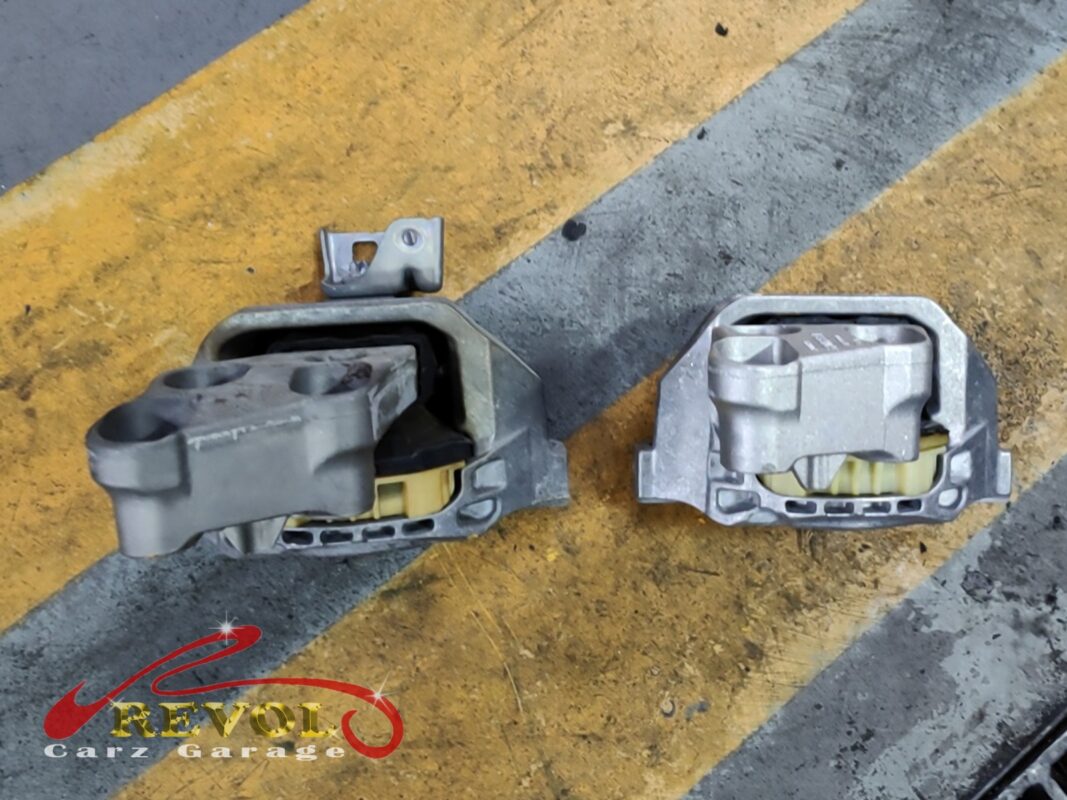 The old gearbox mount (left) beside the new Mercedes-spec replacement (right).
