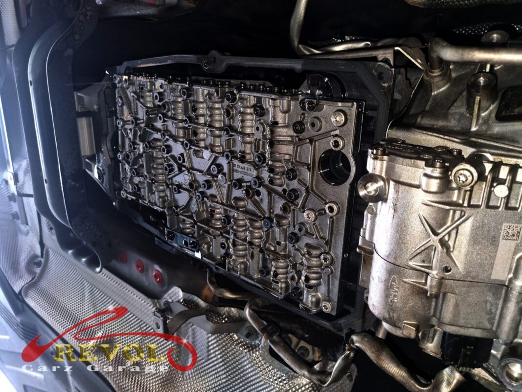 The transmission pan dropped, the valve body exposed for the fluid and filter service.