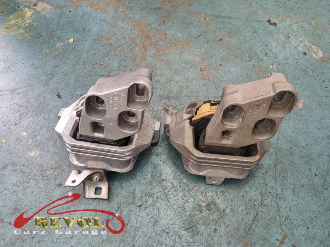 The old engine mount (right) beside the new Mercedes-spec replacement (left).