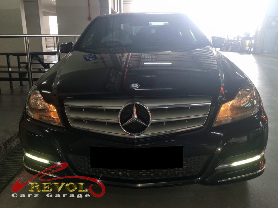 Mercedes-Benz C180 with the front bumper off for radiator replacement.
