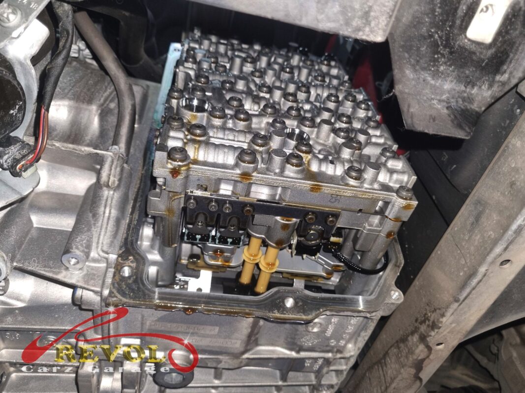 The transmission pan dropped, the valve body and solenoids exposed for the fluid and filter service.