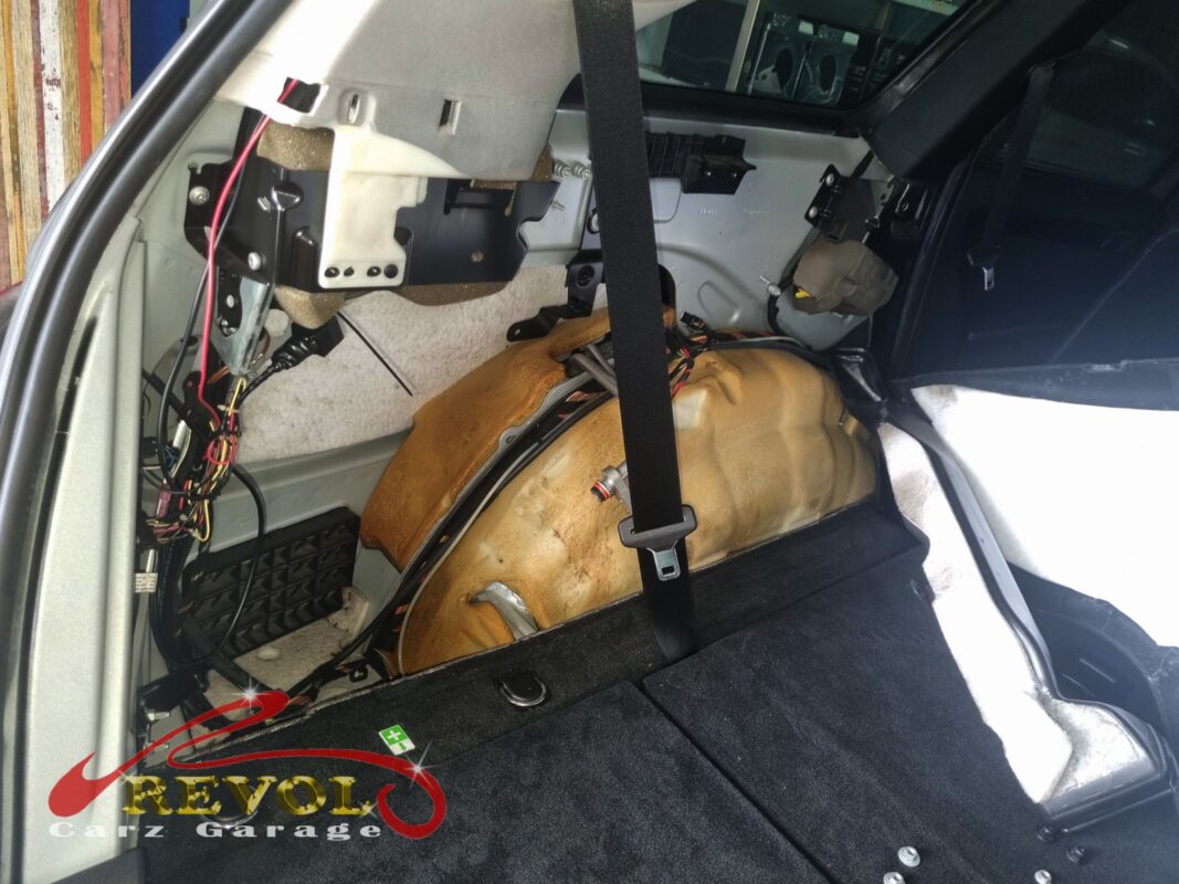 The rear cargo trim removed, the rear HVAC box opened up for the cooling coil.