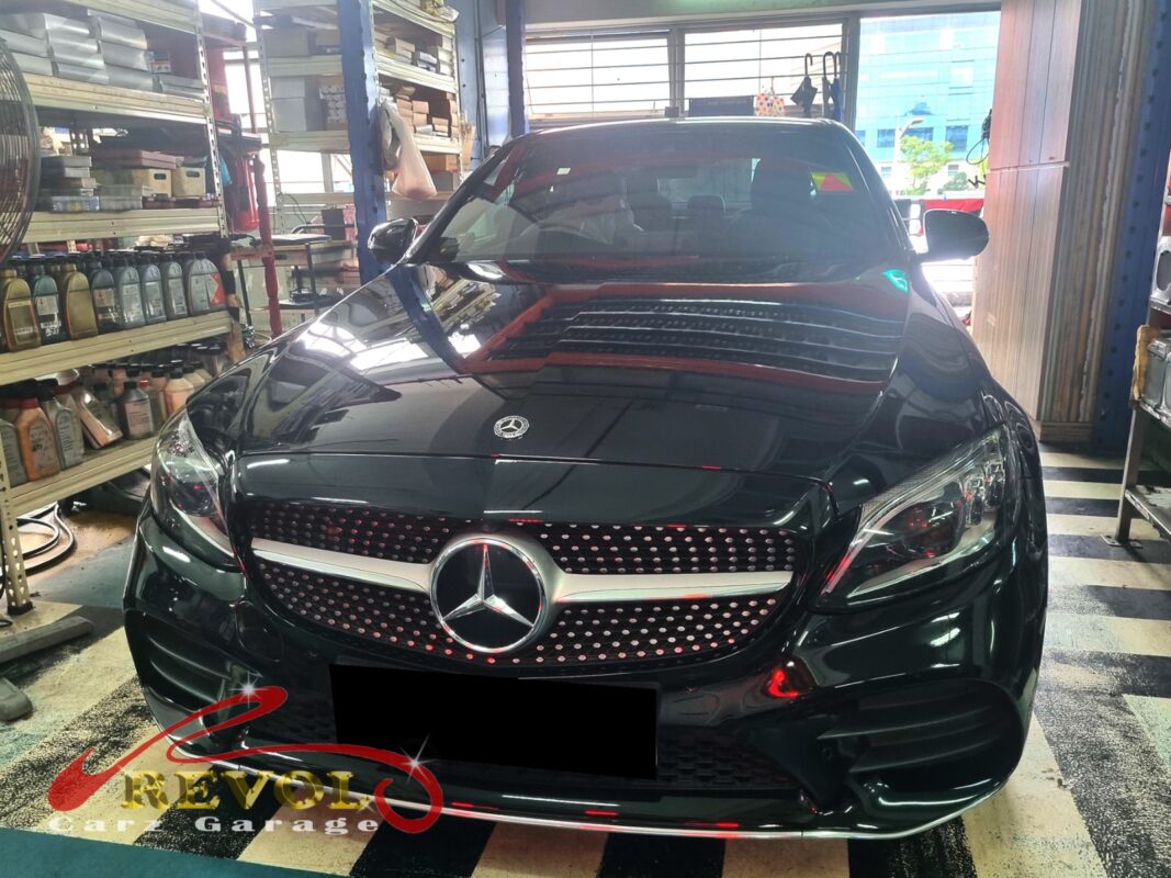 Mercedes-Benz C200 on the workshop lift for upper control arm replacement.
