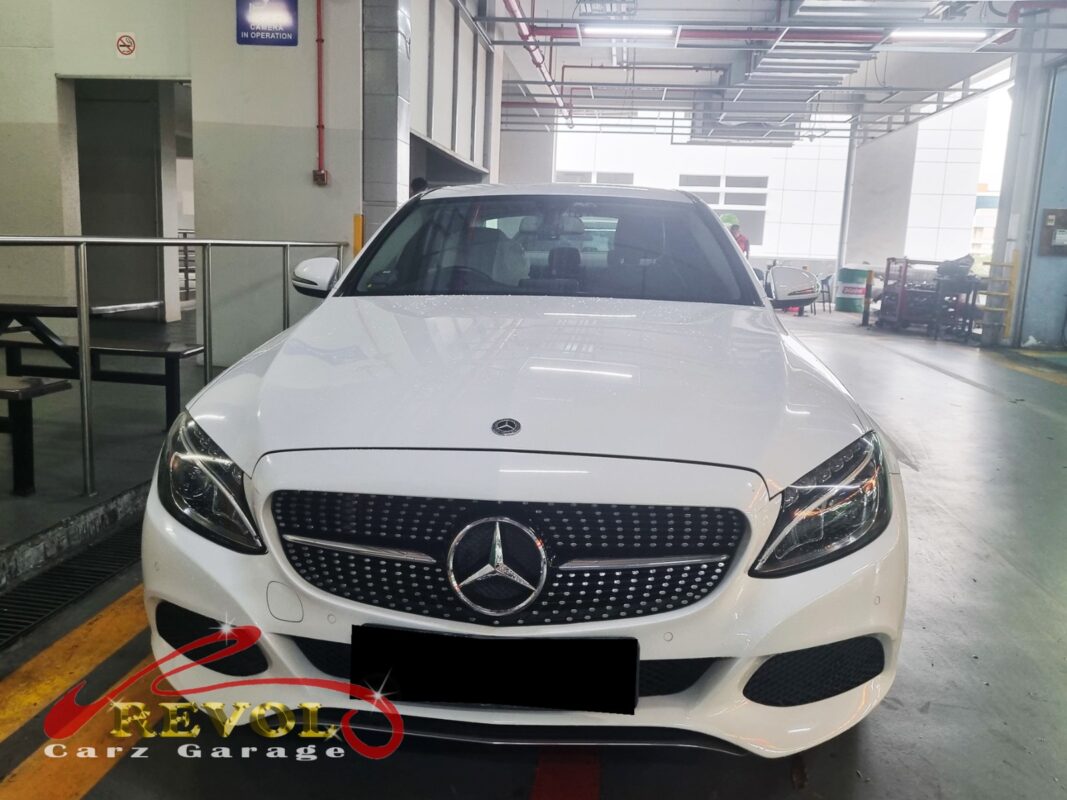 Mercedes-Benz C180 with the front bumper removed for AC condenser replacement.