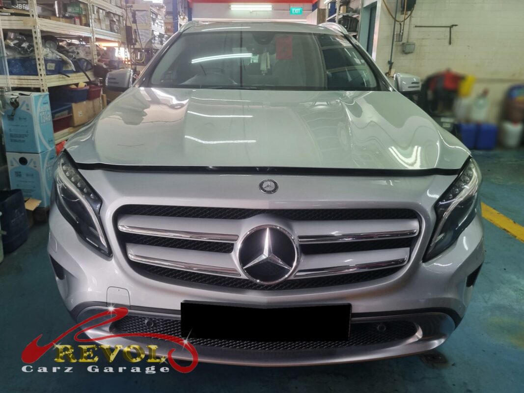 Mercedes-Benz C180 on the workshop lift for routine scheduled servicing.