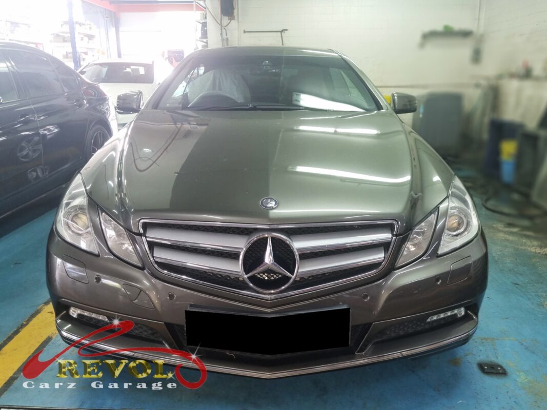 Mercedes-Benz E250 on the workshop lift for anti-roll bar bush replacement.