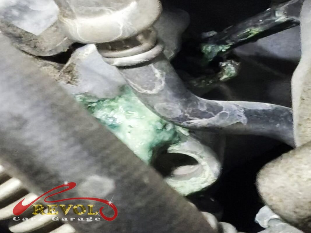Crystallised coolant tracked down the front of the engine, the weep from the failing water pump seal.