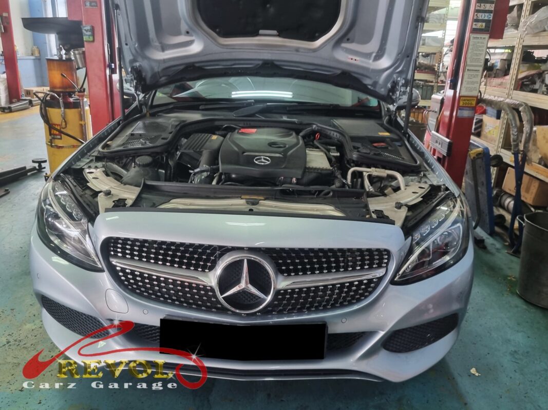Mercedes-Benz C180 with the engine bay open for alternator replacement.