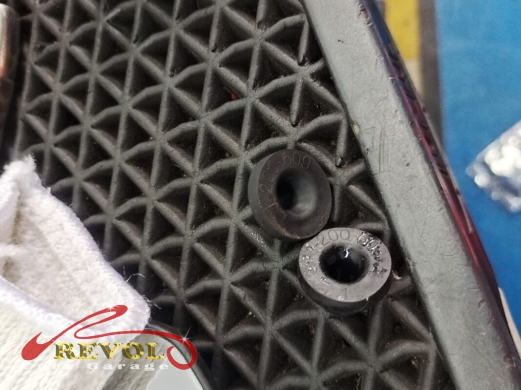 The rubber grommets that seal the washer pump into the reservoir, fitted fresh with the new pump.