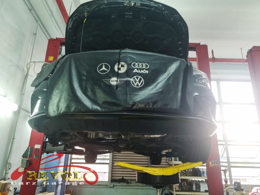 The CLA200 up on the two-post lift, fender cover on, in for its ATF service.