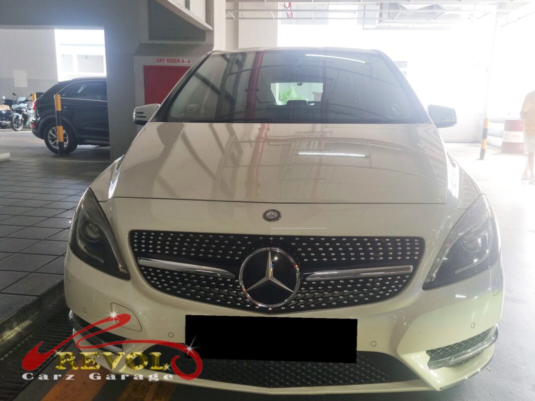 Mercedes-Benz B180 with the bonnet open for battery replacement.