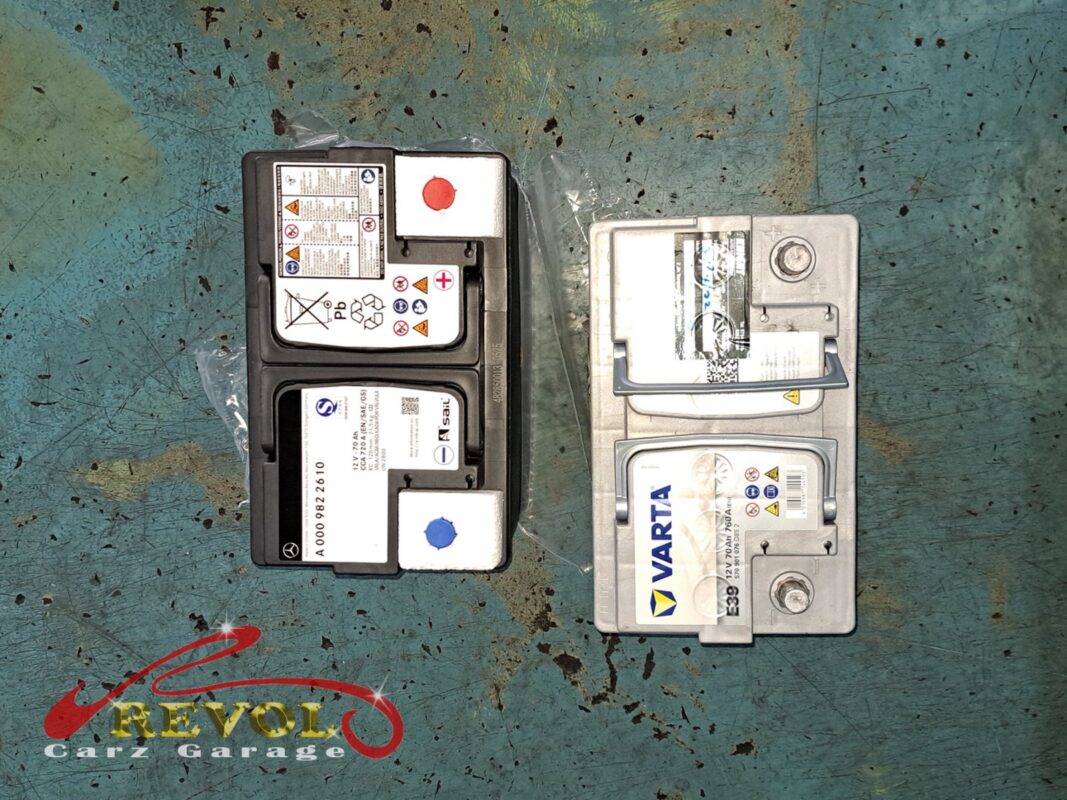 The new Mercedes-spec AGM battery (left) beside the old unit removed (right).