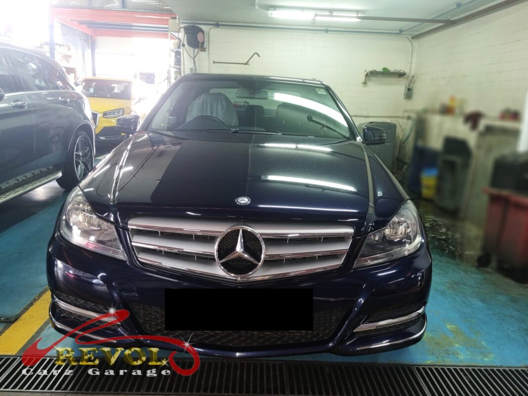 Mercedes-Benz C180 on the workshop lift for the recommended 10,000 km service.