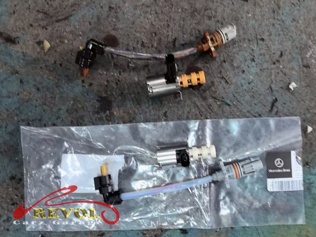 The old oil pump control solenoids removed (top) beside the new Mercedes-spec replacement (bottom).