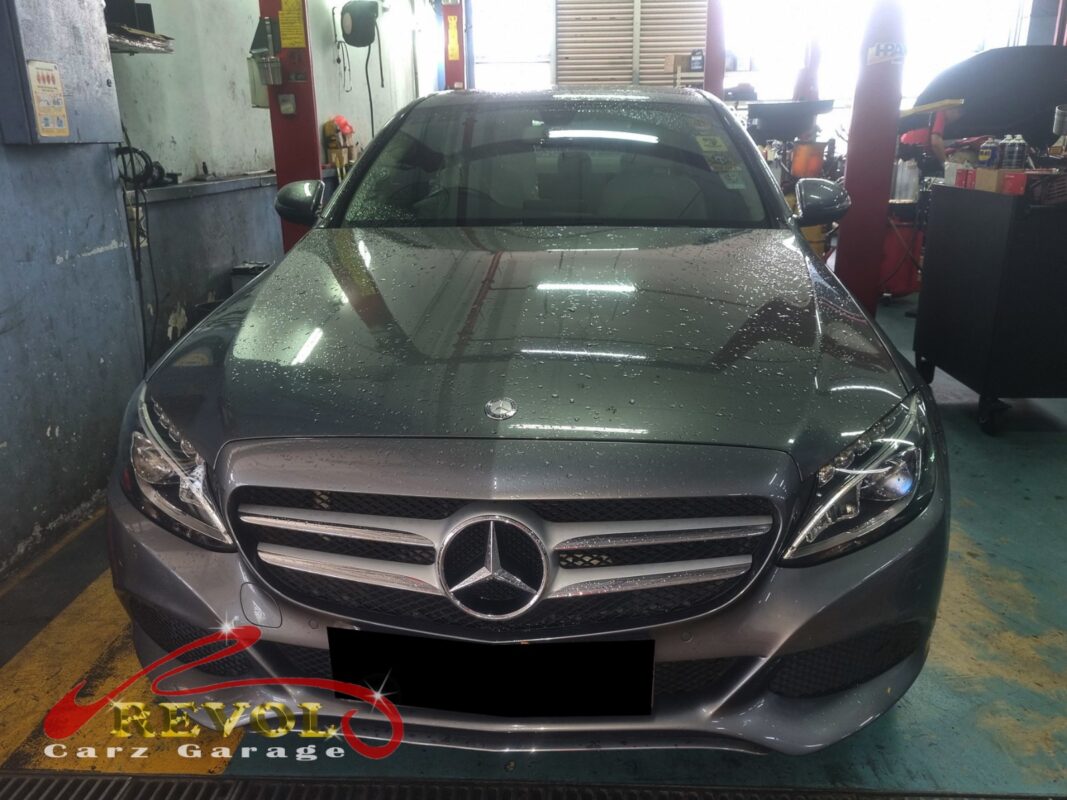 Mercedes-Benz C180 with the engine bay open for thermostat housing replacement.