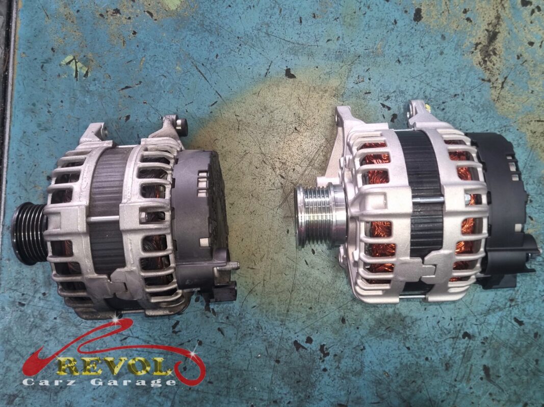 The old alternator (left, grimy) beside the new Mercedes-spec unit (right).