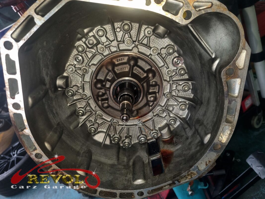 Inside the bellhousing with the gearbox off, the rear of the crankshaft and the seal area exposed.