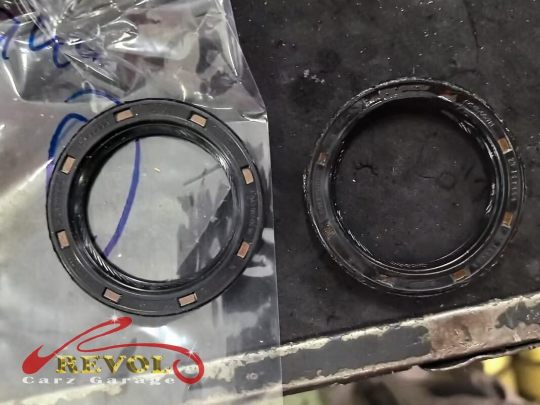 The old rear main seal (right) beside the new Mercedes-spec replacement (left).