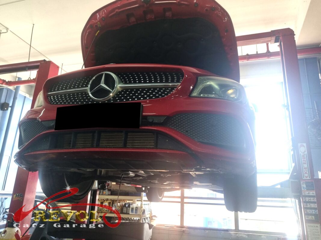 The CLA180 up on the two-post lift, hood open, in for the battery warning.