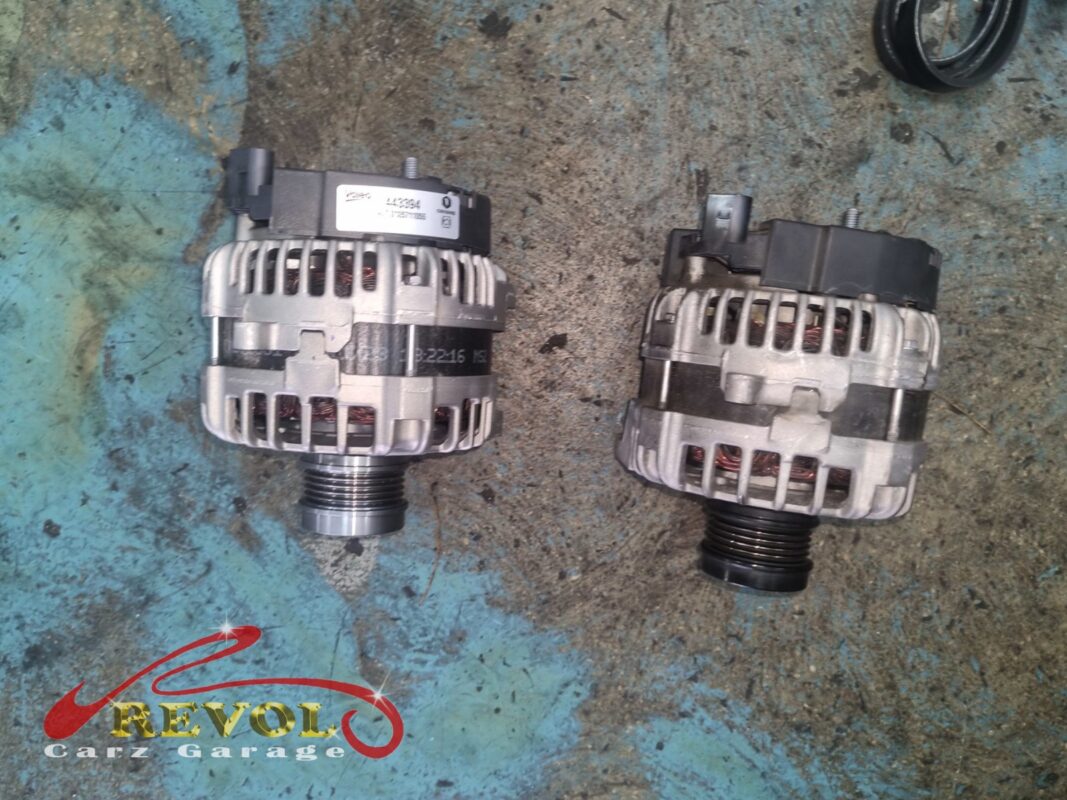 The old alternator (left, grimy) beside the new Mercedes-spec unit (right).