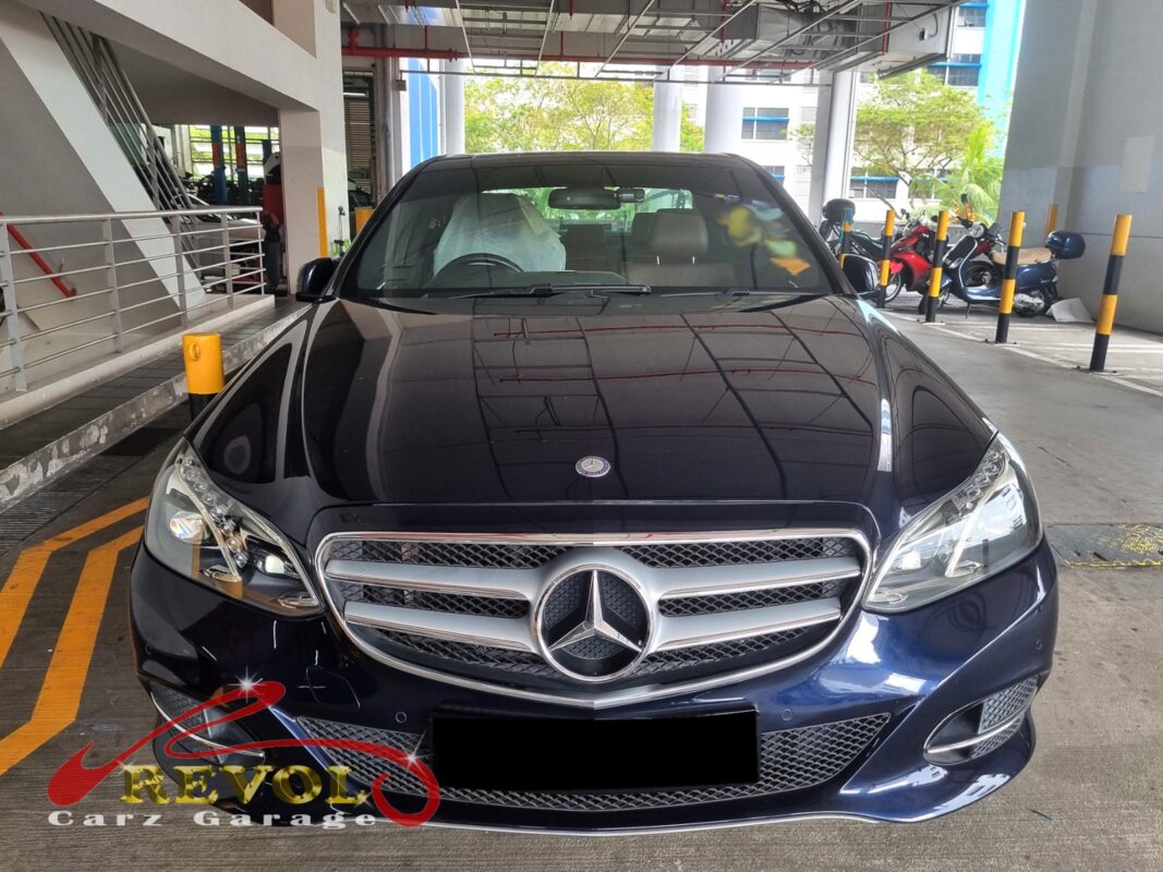 Mercedes-Benz E200 with the rear seat lifted for in-tank fuel pump access.