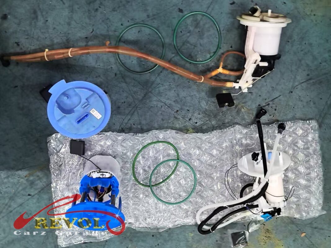 The old fuel pump module and its tank parts (top) beside the new Mercedes-spec replacements (bottom), with fresh seals.