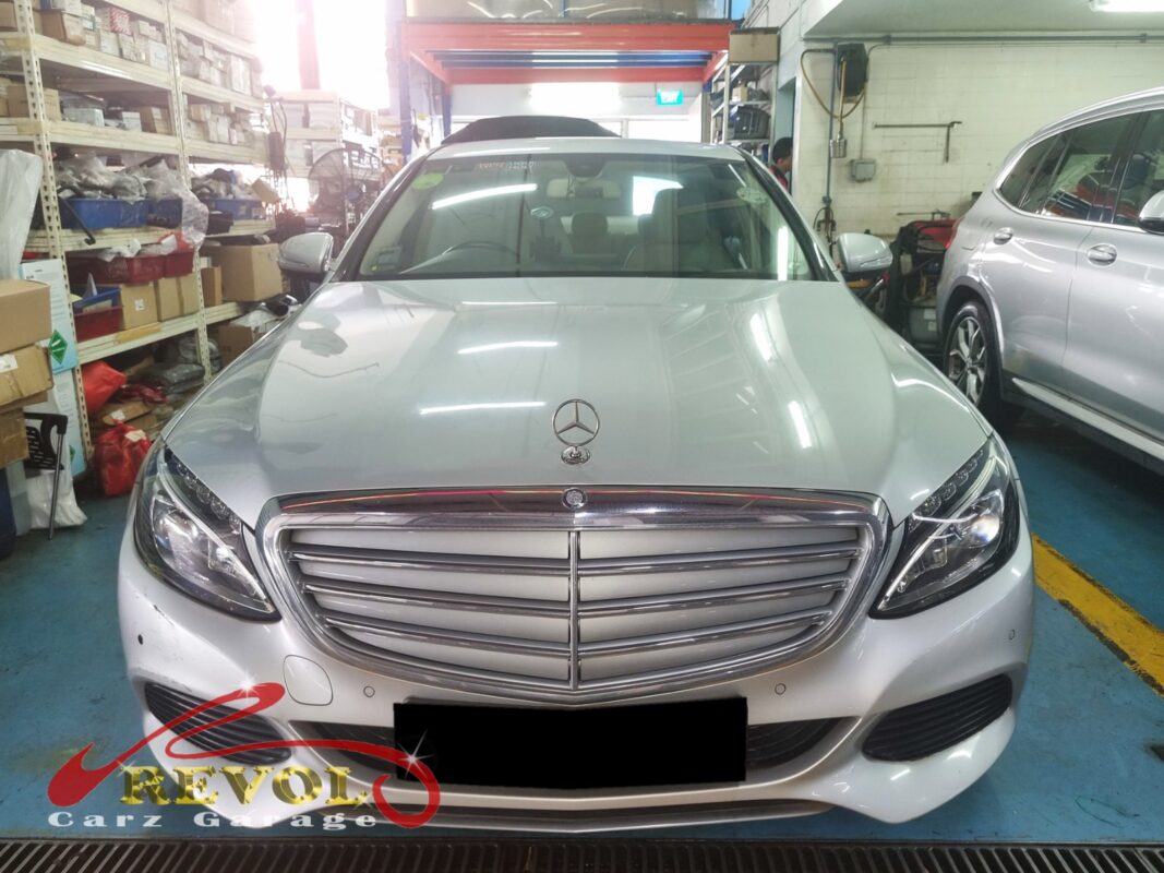 Mercedes-Benz C180 with the engine bay open for aircon compressor replacement.