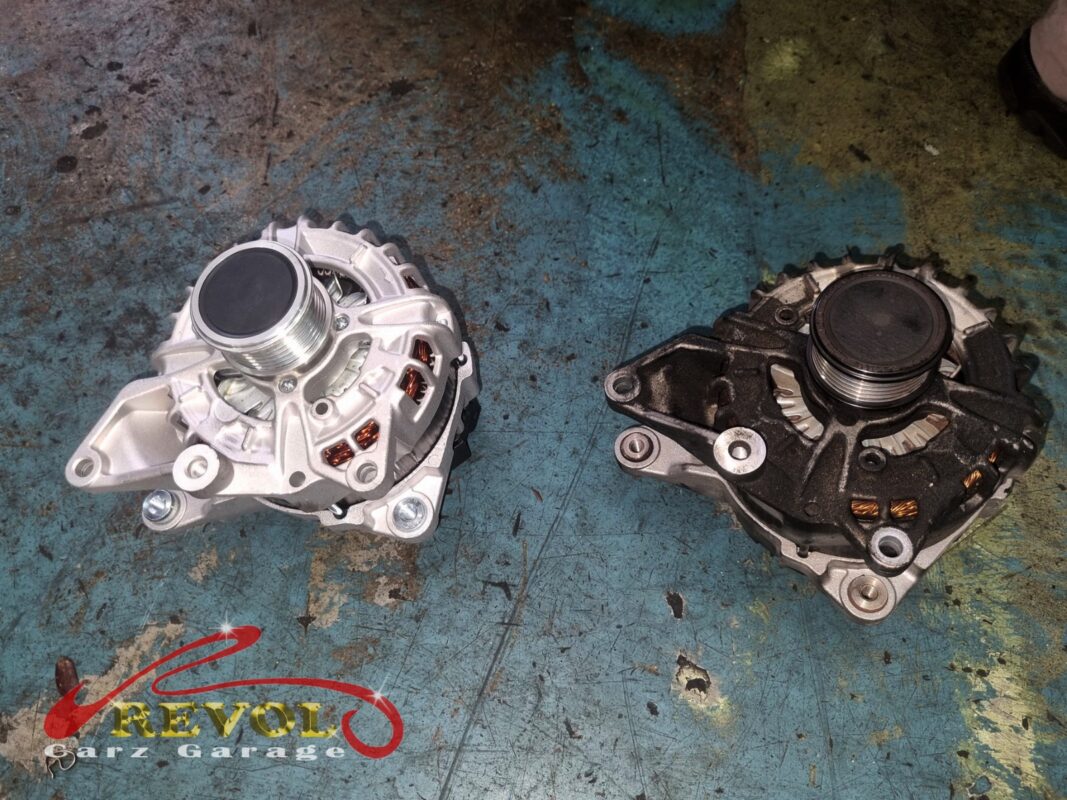 The old alternator (right, grimy) beside the new Mercedes-spec unit (left).