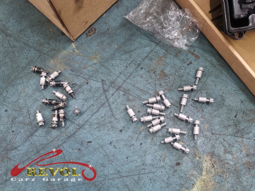 The old valve cover bolts (left) beside the new set (right) that went in with the cover.