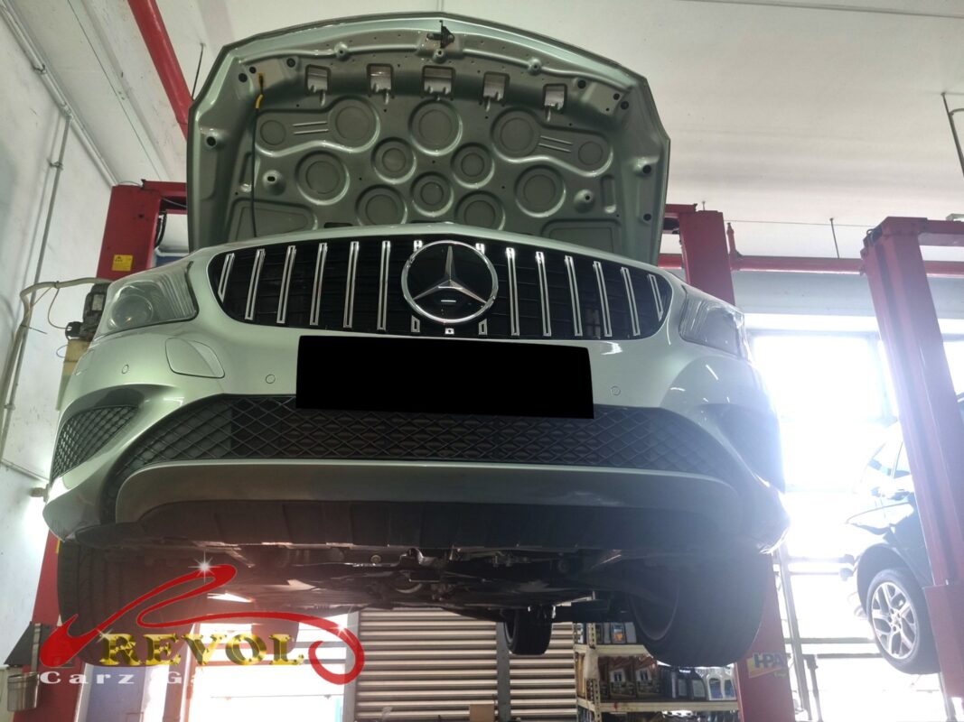 The A180 up on the two-post lift, hood open, in for the flat acceleration.