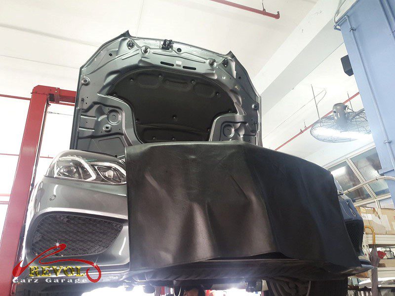 The front suspension checked on the Mercedes-Benz E200, the noise traced to the anti-roll bar links.